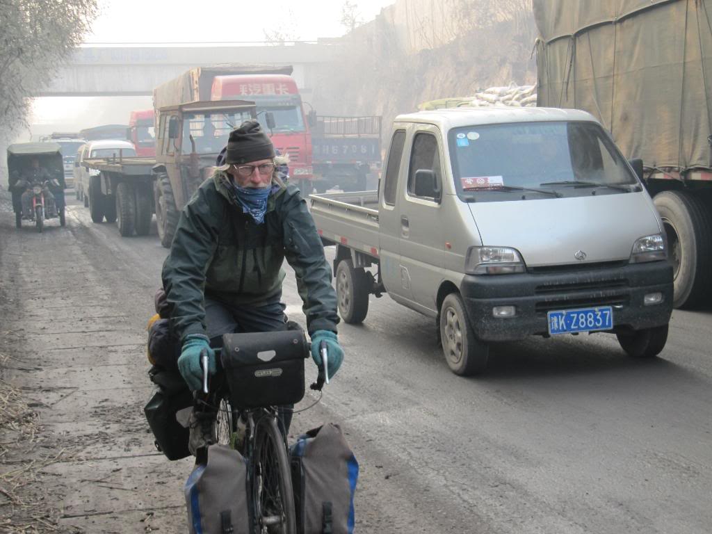 George pedaling through heavy traffic outside Zhengzhou, China